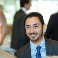 Guest smiling at another guest at the Foundation Annual Meeting